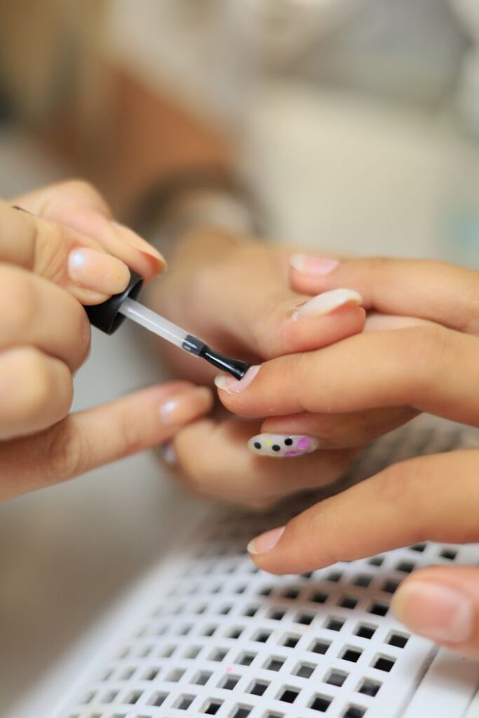 Close-up of a professional manicure session in Istanbul, showcasing detailed nail art prep.
